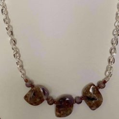 Three chevron amethyst and purple lace agate.